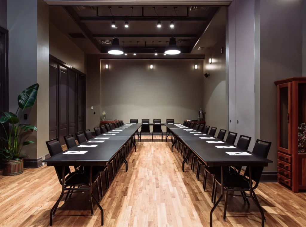 a conference room with a long table and chairs